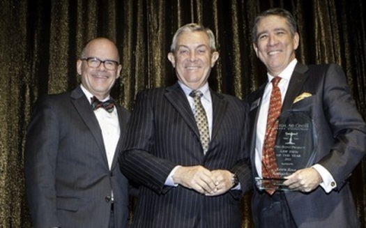 Dan Waite (L) and Dan Polsenberg (R) accept the 2015 Pro Bono Award from Justice James Hardesty for Law Firm of the Year. (Legal Aid Center of Southern Nevada)