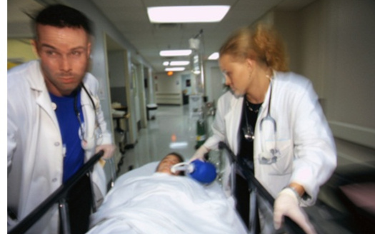 Doctors rush a patient to care. Enrollment for coverage under the Affordable Care Act ends at midnight today. (JillK61)