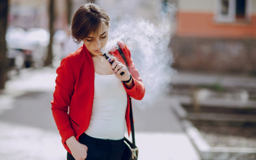 People who use them may think e-cigarettes are harmless, but research says they're not. (prostooleh/iStockphoto)