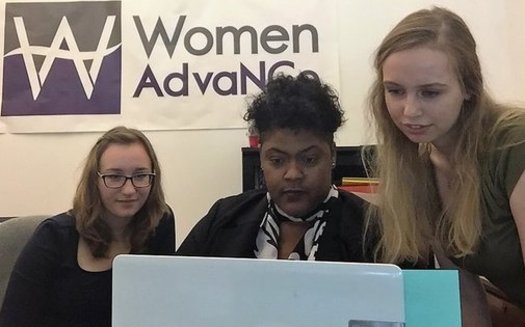 Women AdvaNCe Executive Director Naomi Randolph (center) works with staff members to coordinate the upcoming North Carolina Women's Summit. (Women AdvaNCe)