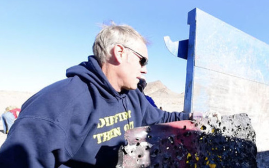 Interior Secretary Ryan Zinke helped clean up a shooting range with Bureau of Land Management workers outside Las Vegas on Thursday. (U.S. Dept. of the Interior)