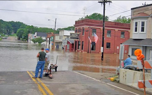 Spring flooding in Wisconsin can be devastating, as in Rock Springs in 2016, when the Baraboo River overflowed. Democrats say a bill under consideration would make flooding worse. (NOAA)