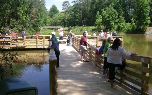 People enjoy access at Tumbling Rock Reservoir in Mount Airy, where they are able to fish and enjoy other activities, regardless of their level of mobility. (City of Mt. Airy)