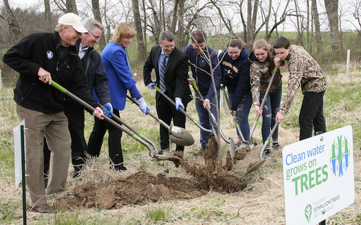 State and federal officials and local high school students joined Chesapeake Bay Foundation president Will Baker in planting the first tree. (B.J. Small/CBF Staff)