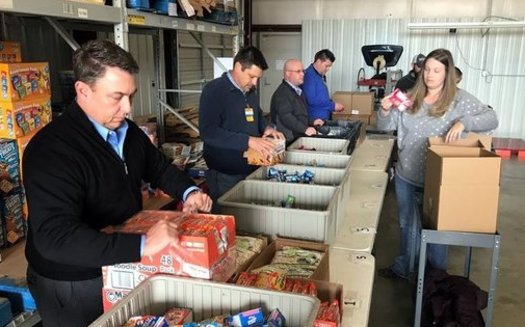 Volunteers help sort products at the Northwest Arkansas Food Bank in the Fayetteville area, one of four regional food banks in the state. (NWArkansasFoodBank)<br /><br />