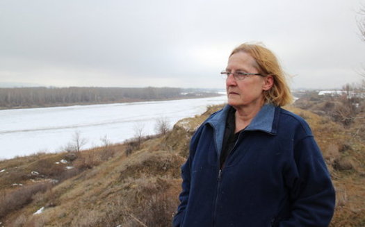 Farmer Dena Hoff, who opposes the Keystone XL project, surveys the Yellowstone River from her property, which was negatively affected by a ruptured pipeline in 2015. (Northern Plains Resource Council)