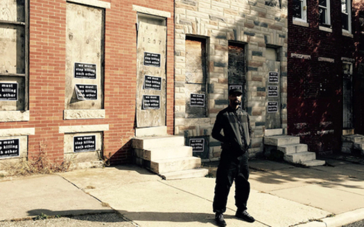Munir Bahar, 36, founder of COR Health Institute, stands in front of four vacant row homes he reconstructed into a community martial arts and fitness facility dedicated to serving at-risk children living in East Baltimore. (COR Health Institute)