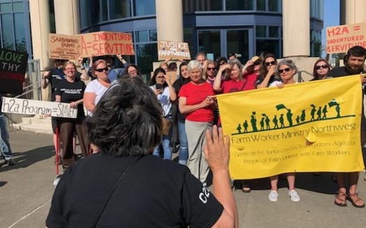Farm workers' advocates protested Tuesday outside a court hearing about the fine for Sarbanand Farms in Sumas, Wash. (Carla Shafer)