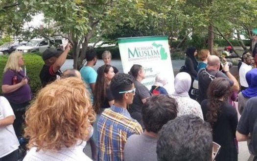 Opponents of the U.S. Supreme Court travel ban decision call on Congress to step in at a rally in Detroit on Tuesday evening. (Michigan Muslim Community Council)