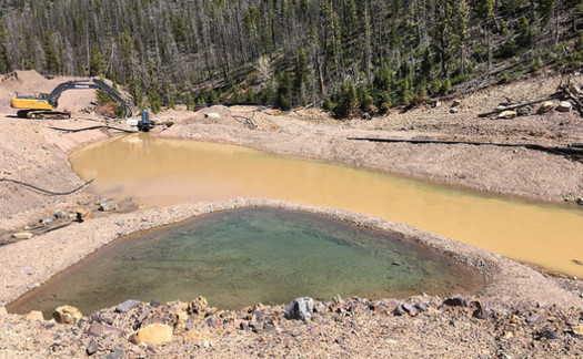 The defunct Mike Horse Mine must be perpetually treated so that it doesn't pollute the nearby Blackfoot River. (Earthworks/Flickr)