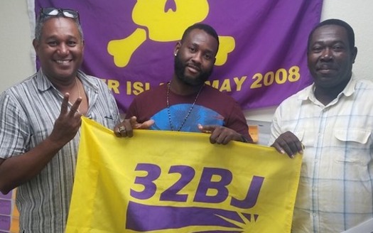 Luc Bastien, left, stands with union brothers at 32BJ SEIU after canvassing. (32BJ SEIU)