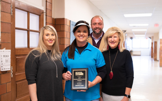 Lashonda Cooper, center, cafeteria manager at Simons Middle School, received the Rising Star Award in the Kentucky School Breakfast Challenge. (Ashley Lauren Photography)