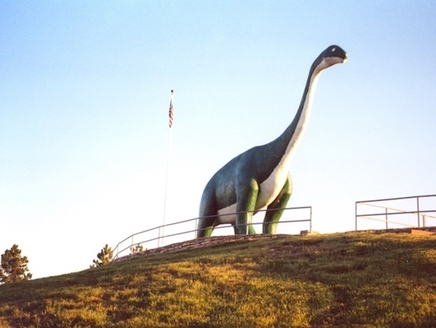 The apatosaurus, such as this concrete replica at Dinosaur National Park near Rapid City, roamed the state during the Mesozoic Era, 150 million years ago. (Wikimedia Commons)