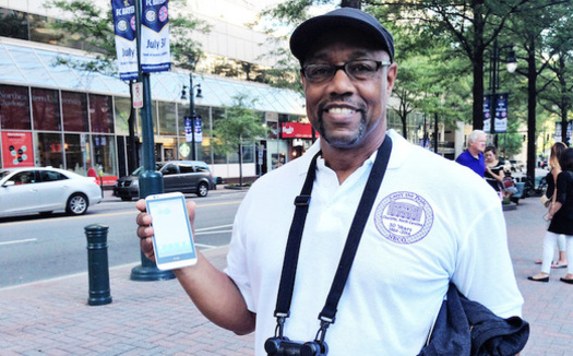 Ronald Ross holds an air-pollution monitoring device used in the AirKeepers project. (Clean Air Carolina)