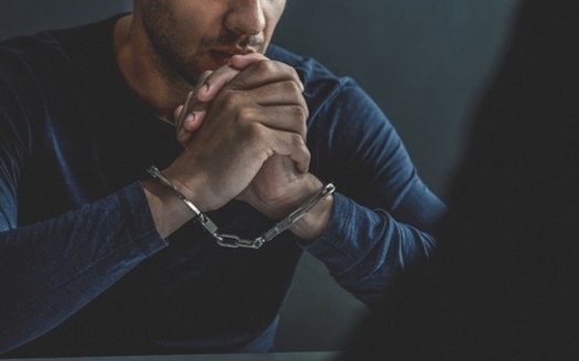 A new report says too many people are being held in jail before trial, many because they can't afford to pay bail. (kritchanut/Adobe Stock)