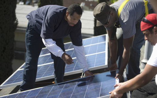 Proponents of clean energy say training workers to install solar power could help the climate and create jobs in areas hardest hit by pollution. (biker3/Adobe Stock)