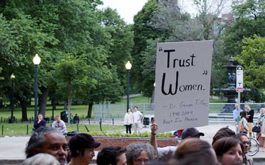 Protesters in Boston denounce anti-abortion violence, holding a sign to honor Dr. George Tiller, an abortion provider who was murdered in Kansas in 2009. (Tim Pierce/Wikipedia)