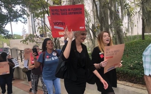 A coalition of Florida organizations rallies in Tallahassee against Senate Bill 7066, which stipulates all prison-related fines must be paid before a person's voting rights can be restored. (Trimmel Gomes) 