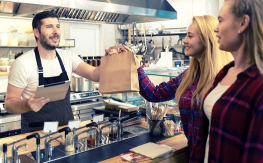 Most Arizona hourly workers, including food service, hospitality and retail employees, received a pay raise on Jan. 1, 2020, under the state's minimum wage law. (rentea/Adobe Stock)