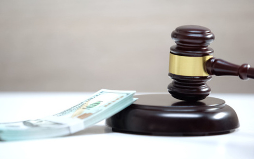 Judges are supposed to consider ten factors, including a person's ability to pay, when setting bail. (motortion/Adobe Stock)