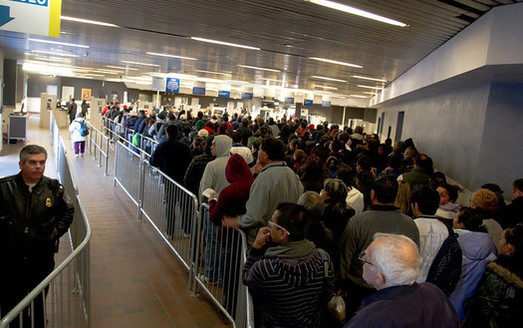 Migrants and others often face long lines and other delays at the U.S.-Mexico border in their quest to gain asylum in the United States. (JDenmark/Flickr)