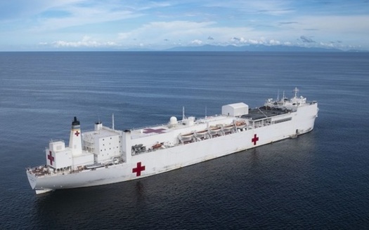 People with disabilities loaded hundreds of pallets of provisions on the USNS Comfort for its trip to New York. (U.S. Navy)