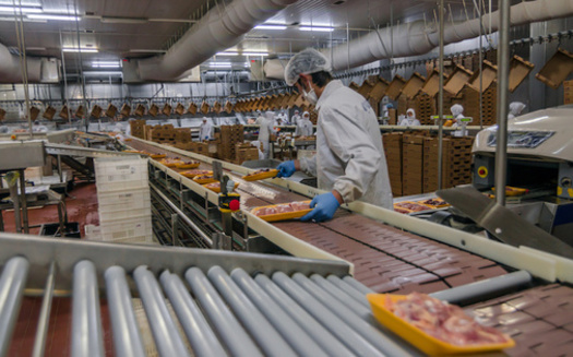 Tight working conditions on production lines in meat and poultry processing facilities make it impossible for workers to adhere to 6-foot distancing. (Adobe Stock)