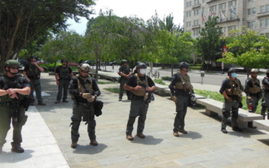 Law enforcement officers with no visible identification wait for protesters in downtown Washington, D.C., on Sat., June 6. (Wikimedia Commons)