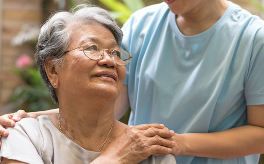 Family caregivers spend nearly 24 hours a week on average providing care, according to AARP. (Khunatorn/Adobe Stock)
