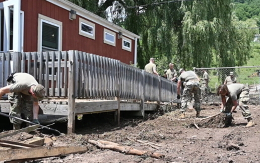 West Virginia National Guard members remove debris after a 2019 flood in Harman. Damaging floods have increased in the state along with the climate crisis. (U.S. National Guard)