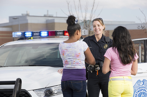 Research shows allowing police officers to handle minor infractions in schools often marks a student's first contact with the criminal justice system, potentially setting them up for a lifetime of collateral consequences. (Adobe Stock)
