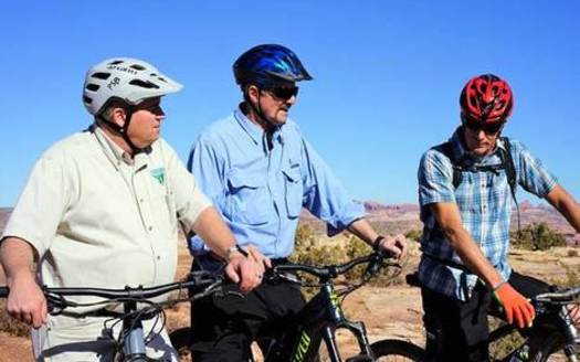 Acting Director of the Bureau of Land Management, William Pendley Perry (center), tours outdoor trails near Moab in 2019 with several BLM staff members. (BLM)  