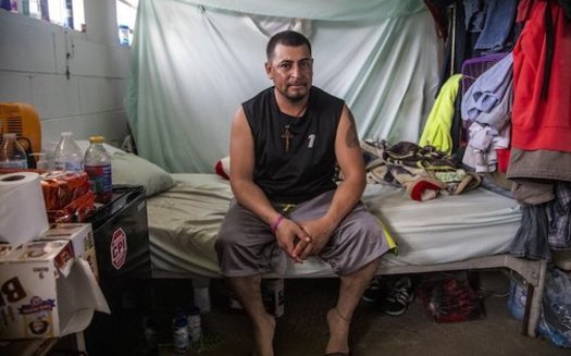 Jos Indalecio, a tractor operator, sits in his living quarters at a Johnston County farmworker camp on Aug. 27. The camp does not have air conditioning, which is considered a luxury by many farmworkers in North Carolina. (Travis Long, TLONG@NEWSOBSERVER.COM)