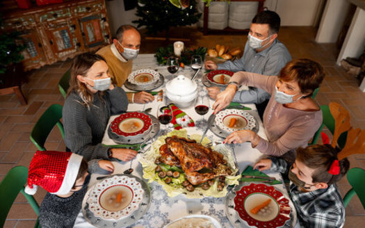 Experts advise using compassion if the conversation veers into difficult political territory around this year's holiday dinner table. (Adobe Stock)