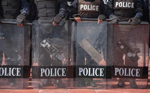 Civil-rights advocates point out that police regularly confront social-justice demonstrations with militarized force. (saksuvan/Adobe Stock)