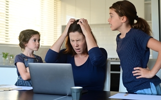 Experts are concerned that many parents haven't been equipped in the pandemic to cope with the stress of working at home while their children are learning from home. (Rafael Ben-Ari/Adobe Stock)