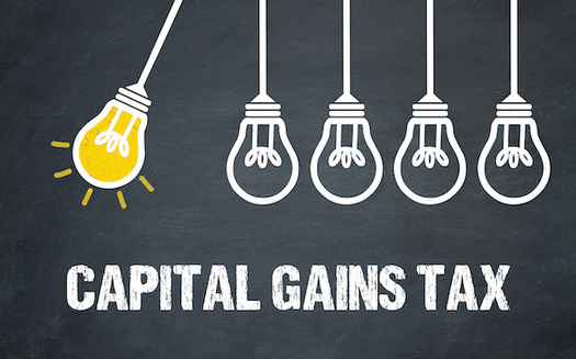 Washington state's capital gains tax is expected to bring in about $415 million in 2023. (magele-picture/Adobe Stock)