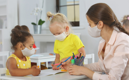 The pandemic has put added stress on the child-care workforce across the country. In Washington state, it caught the attention of legislators, who've included more money for pay and health benefits in the new state budget. (ShunTerra/Adobe Stock)