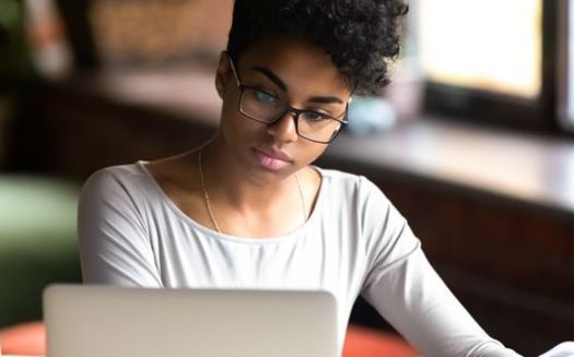 Black women carry roughly 20% more student debt than do their white counterparts. (Adobe Stock)