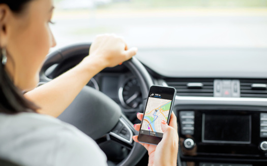 Uber and Lyft are among the app-based companies that successfully campaigned for a ballot initiative to allow them to classify their workers as independent contractors. (Kaspars Grinvalds/Adobe Stock)