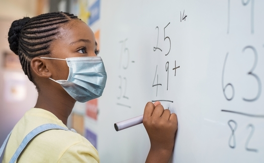 Despite concerns of Utah parents that school-age children could be vulnerable to COVID-19 when they return to class, the state bars school districts from requiring face masks. (Rido/Adobe Stock)