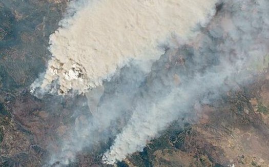 A new report predicts massive blazes such as the Dixie fire will become more common if the world fails to control carbon pollution. (NASA Earth Observatory)
