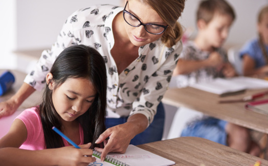 Advocates say South Dakota has made progress in compensating teachers, but still lags behind neighboring states, including trailing North Dakota educators by $4,000 in annual salary. (Adobe Stock)