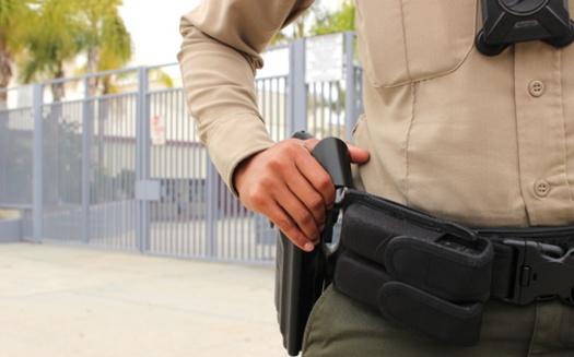 More than a dozen school districts across California have begun to reassess their school resource officer programs, in an effort to limit the number of students entering the justice system. (Simone/Adobestock).