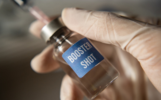 Along with older people, vaccine booster shots are recommended for workers such as health professionals and grocery store workers. (wachiwit/Adobe Stock)