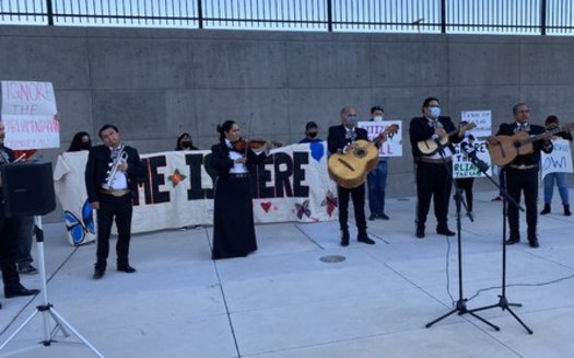 A mariachi brand entertains at the vigil on immigration reform Tuesday night in Las Vegas. (PLAN)