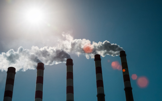 Cutting greenhouse-gas emissions as part of an effort to slow climate change also reduces air pollutants, such as fine particulate matter, that harm human health, according to the National Institute of Environmental Health Sciences. (Adobe Stock)<br />