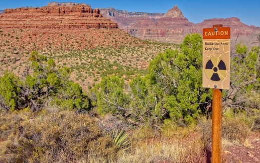 A sign warns of radioactivity near an abandoned uranium mine in the Horseshoe Mesa area near the Grand Canyon. (Deep Desert Photo/Adobe Stock)<br />