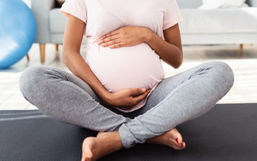 Doulas are trained to provide physical, emotional and informational support to pregnant people during labor, birth and postpartum. (Adobe Stock)