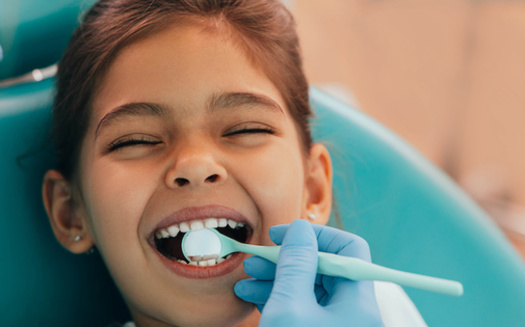 The American Association of Pediatric Dentists recommends children receive a regular dental cleaning and exam every six months, starting when their first tooth comes in. (Adobe Stock)<br />